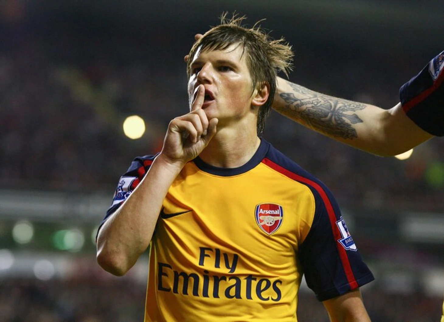 A striker celebrating with a finger to his lips